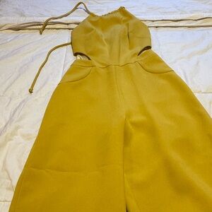 Jumpsuit greenish/yellowish. Size XS.
